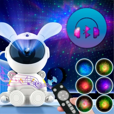 Projector bunny - astronaut with remote control - projection of the starry sky, galaxy, space